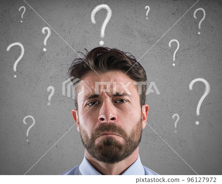 Confused and pensive businessman worried about the future 96127972