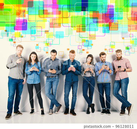 Group of boys and girls connected with their smartphones. Concept of internet and social network 96128011