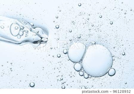 The texture of a cosmetic serum with a pipette closeup. Macrophotography The texture of a cosmetic serum with a pipette closeup. Macrophotography 96128932