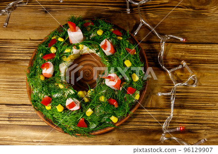 Salad Christmas wreath on a wooden table. Top view Salad Christmas wreath on a wooden table. Top view 96129907