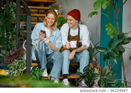 Happy decorators taking break during work at creative art studio 96129947