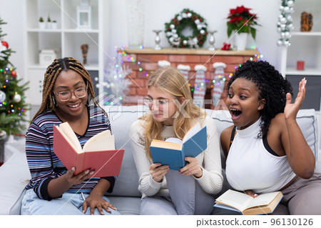 A funny story read in a book. Friends from Africa and Europe. A funny story read in a book. Friends from Africa and Europe. 96130126