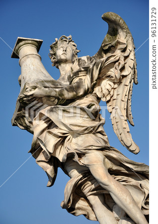 Angel statue against blue sky. Rome, Italy Angel statue against blue sky. Rome, Italy 96131729