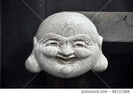 Handmade smiling Buddha wooden statue in Vietnam 96131966