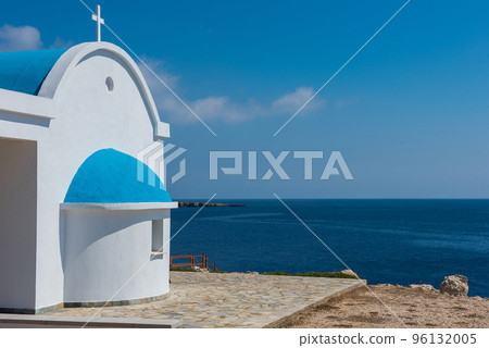 Traditional white chapel with a blue roof on the seaside. Agioi Anargyroi, Cyprus 96132005