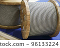 Rope metal steel on a wooden coil. Industrial wire cable 96133224