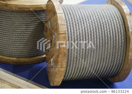 Rope metal steel on a wooden coil. Industrial wire cable 96133224