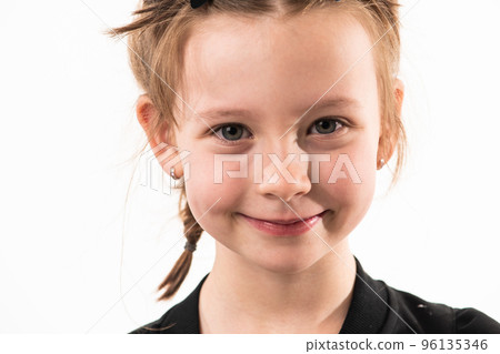 Portrait of a little girl on a white background with healthy, developing teeth Portrait of a little girl on a white background with healthy, developing teeth 96135346