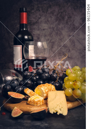 still life wine different cheeses and fruits 96135404