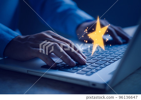 Customer reviews star. Customer service evaluation and satisfaction. Businessman hands typing notebook (Laptop). Top service, ISO certification, Guarantee, Quality assurance, Standards concept. 96136647
