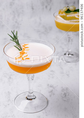 Refreshing cocktail decorated with sprig of rosemary Refreshing cocktail decorated with sprig of rosemary 96137406