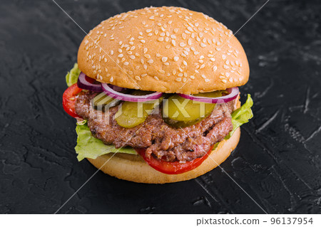 Tasty cheeseburger isolated on black stone 96137954
