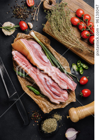 Delicious homemade raw-smoked, cured bacon top view Delicious homemade raw-smoked, cured bacon top view 96138047