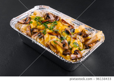 Baked mushrooms, potatoes and cheese closeup Baked mushrooms, potatoes and cheese closeup 96138433