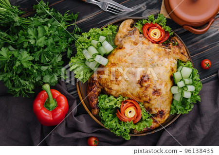 Roast chicken with fresh vegetables top view Roast chicken with fresh vegetables top view 96138435