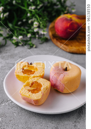 Two small french mousse cake apple shaped dome served on a plate 96138550