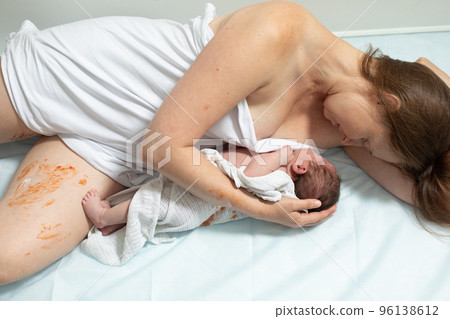 Woman with new born baby have a rest Woman with new born baby have a rest 96138612