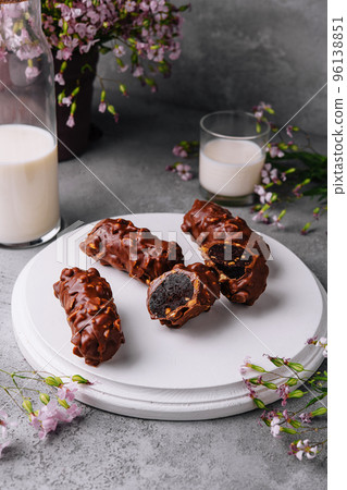 chocolate bars on plate with milk 96138851