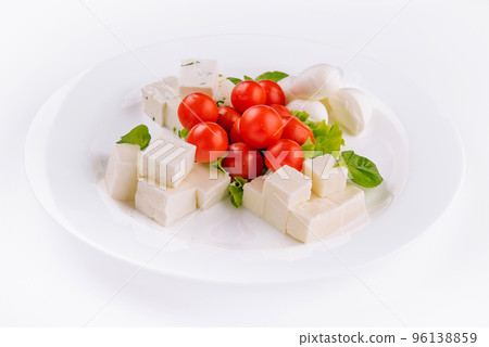 Mozzarella cheese with cherry tomatoes and goat cheese Mozzarella cheese with cherry tomatoes and goat cheese 96138859
