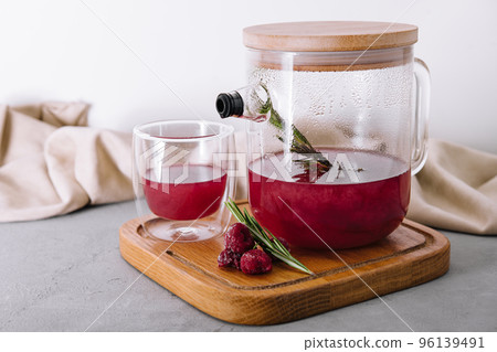 fruit raspberry tea in glass teapot and cup fruit raspberry tea in glass teapot and cup 96139491