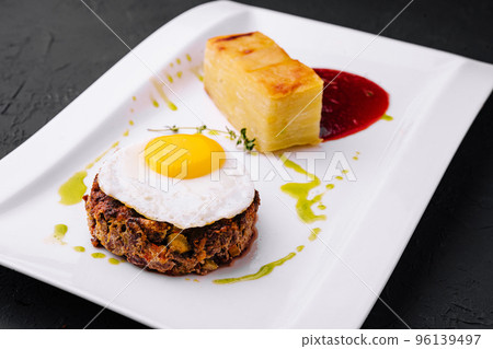 fried vegetable tartare with egg on plate 96139497