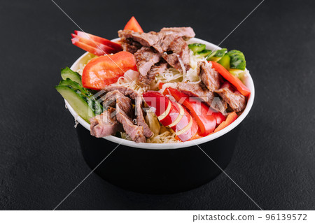 Warm salad with veal and vegetables Warm salad with veal and vegetables 96139572