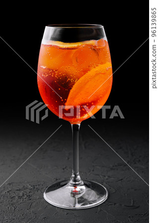 glass of aperol spritz cocktail on black background glass of aperol spritz cocktail on black background 96139865