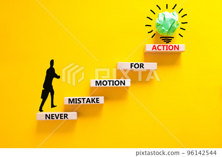 Mistake or action symbol. Concept words Never mistake motion for action on wooden blocks. Businessman icon. Beautiful yellow table yellow background. Business mistake or action concept. Copy space. Mistake or action symbol. Concept words Never mistake motion for action on wooden blocks. Businessman icon. Beautiful yellow table yellow background. Business mistake or action concept. Copy space. 96142544