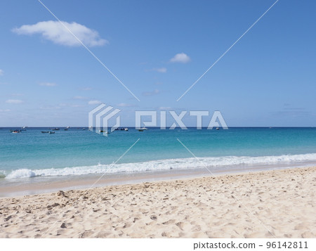 Boats and white waves on Atlantic Ocean at Sal island in Cape Verde Boats and white waves on Atlantic Ocean at Sal island in Cape Verde 96142811