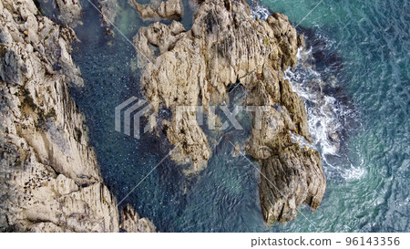 A lot of boulders in the sea water. Coastal cliffs of the North Atlantic. Seaside beautiful nature. Dramatic seascape of the north of Europe. Aerial photo. A lot of boulders in the sea water. Coastal cliffs of the North Atlantic. Seaside beautiful nature. Dramatic seascape of the north of Europe. Aerial photo. 96143356