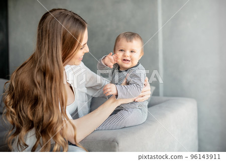 Little child smiling and happy with mom 96143911