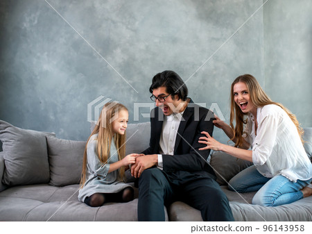Happy little girl play with her mother and father Happy little girl play with her mother and father 96143958
