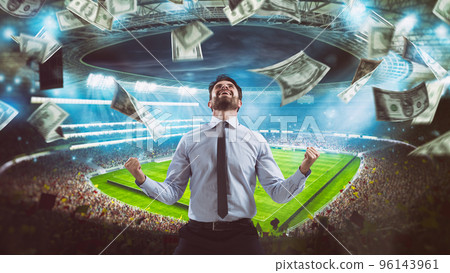 Man who rejoices at the stadium for winning a rich soccer bet 96143961