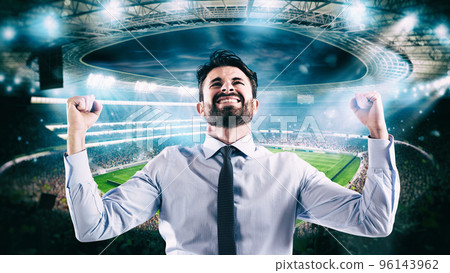 Man who rejoices at the stadium for winning a rich soccer bet 96143962