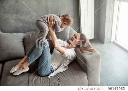 Little child smiling and happy with mom Little child smiling and happy with mom 96143985
