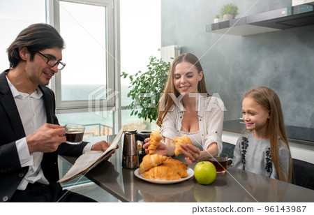 Happy family have a breakfast at home Happy family have a breakfast at home 96143987