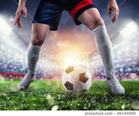 Soccer player ready to kick the soccerball at the stadium during the match. Soccer player ready to kick the soccerball at the stadium during the match. 96144000