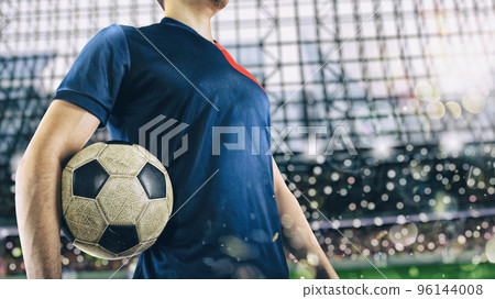 Soccer player ready to play with soccerball at the stadium 96144008
