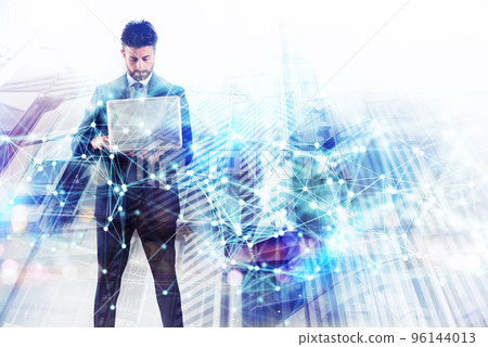 Businessman works with laptop. Concept of teamwork and partnership. double exposure with network effects 96144013