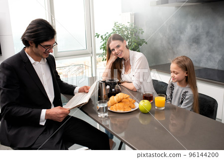 Happy family have a breakfast at home Happy family have a breakfast at home 96144200