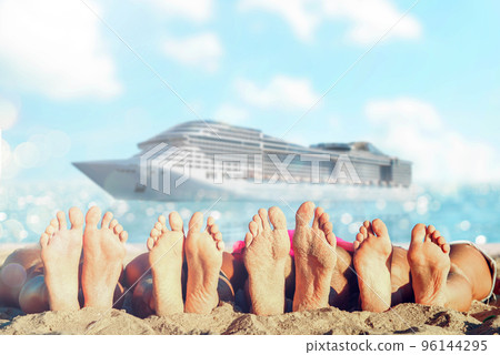 Group of friends having fun on the beach with their foots. Concept of summertime. 96144295