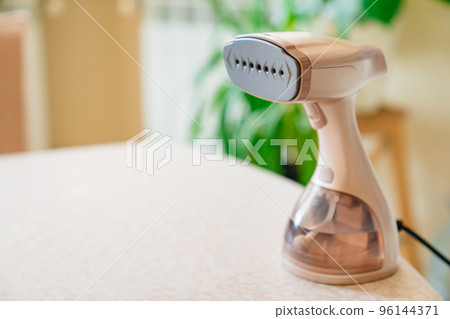 portable hand steamer for clothes. steam for ironing clothes. portable hand steamer for clothes. steam for ironing clothes. 96144371