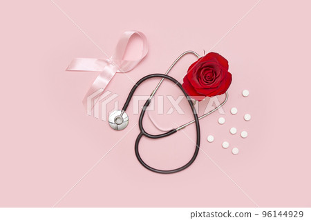 a red rose and a stel on a pink background with copy - space for your text or image stock photo a red rose and a stel on a pink background with copy - space for your text or image stock photo 96144929