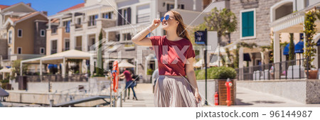 BANNER, LONG FORMAT Woman tourist enjoying the views of Architecture and luxury yachts in Lustica Bay, Montenegro. Travel around Montenegro concept. Go Everywhere BANNER, LONG FORMAT Woman tourist enjoying the views of Architecture and luxury yachts in Lustica Bay, Montenegro. Travel around Montenegro concept. Go Everywhere 96144987