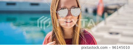 BANNER, LONG FORMAT Woman tourist enjoying the views of Architecture and luxury yachts in Lustica Bay, Montenegro. Travel around Montenegro concept. Go Everywhere BANNER, LONG FORMAT Woman tourist enjoying the views of Architecture and luxury yachts in Lustica Bay, Montenegro. Travel around Montenegro concept. Go Everywhere 96145010