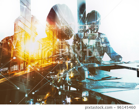 Silhouette of business people work together in office. Concept of teamwork and partnership. double exposure with network effects 96145460