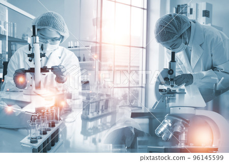 Double exposure microscope and Young woman scientific using equipment in the laboratory for research 96145599