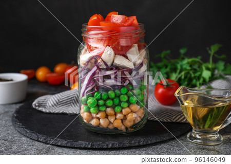 Healthy salad in glass jar on grey table 96146049