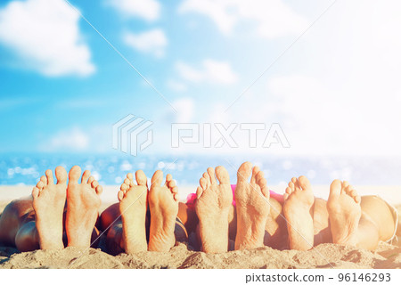 Group of friends having fun on the beach with their foots. Concept of summertime 96146293