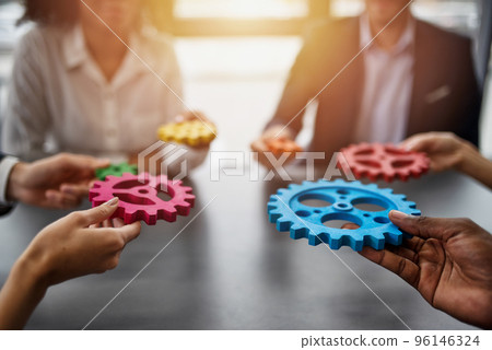 Business team connect pieces of gears. Teamwork, partnership and integration concept Business team connect pieces of gears. Teamwork, partnership and integration concept 96146324